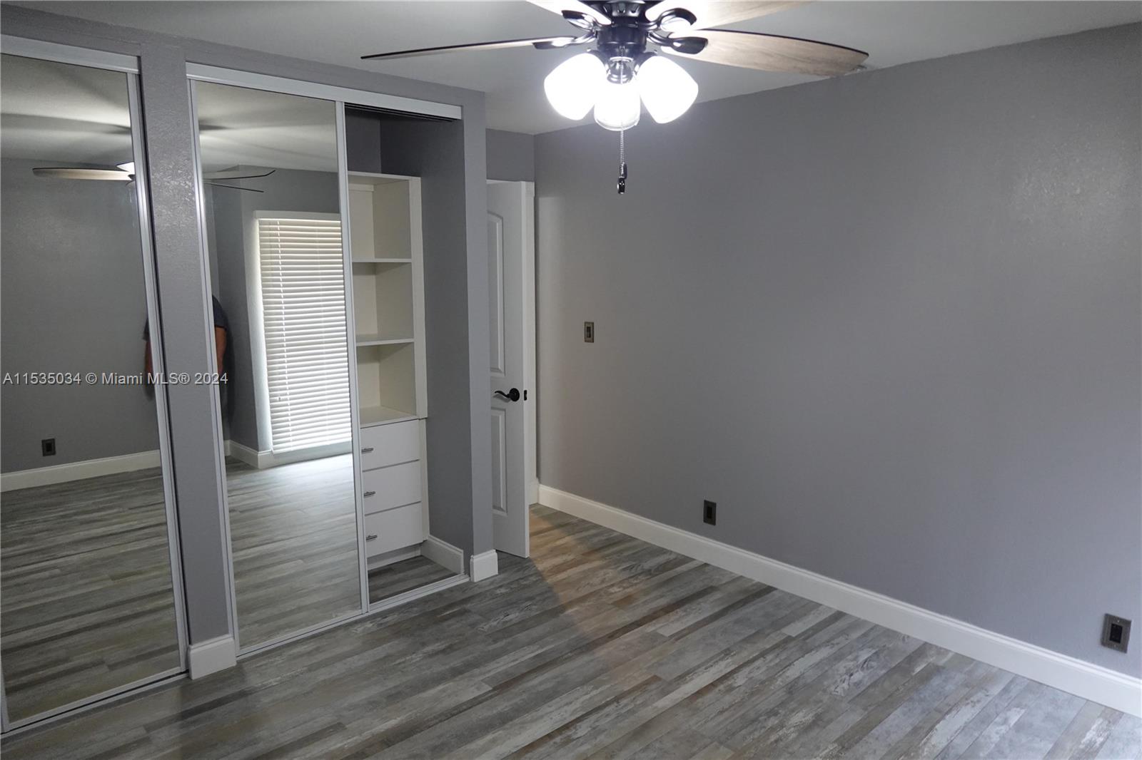 Townhouses at Jacaranda Condominiums Plantation, FL 33324 - Photo 26 of 50 a view of empty room with wooden floor