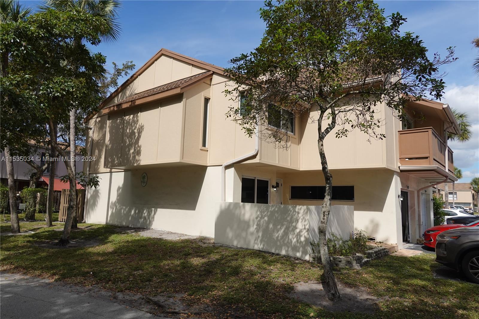 Townhouses at Jacaranda Condominiums Plantation, FL 33324 - Photo 3 of 50 a view of a house with a yard