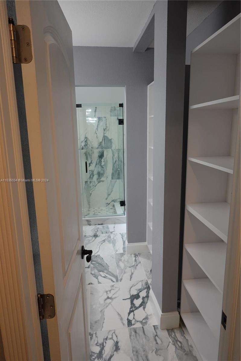 Townhouses at Jacaranda Condominiums Plantation, FL 33324 - Photo 31 of 50 a bathroom with a bathtub