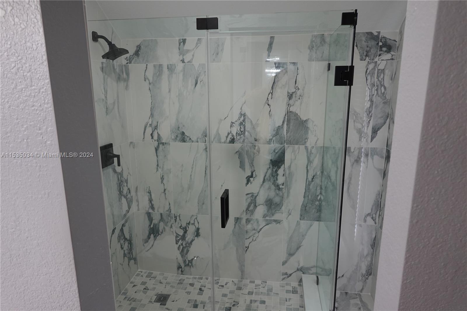 Townhouses at Jacaranda Condominiums Plantation, FL 33324 - Photo 33 of 50 a bathroom with a shower and a sink