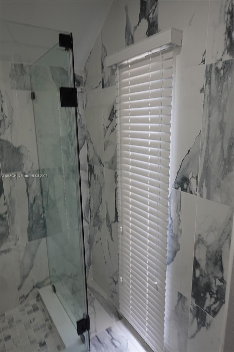 Townhouses at Jacaranda Condominiums Plantation, FL 33324 - Photo 35 of 50 a bathroom with a shower