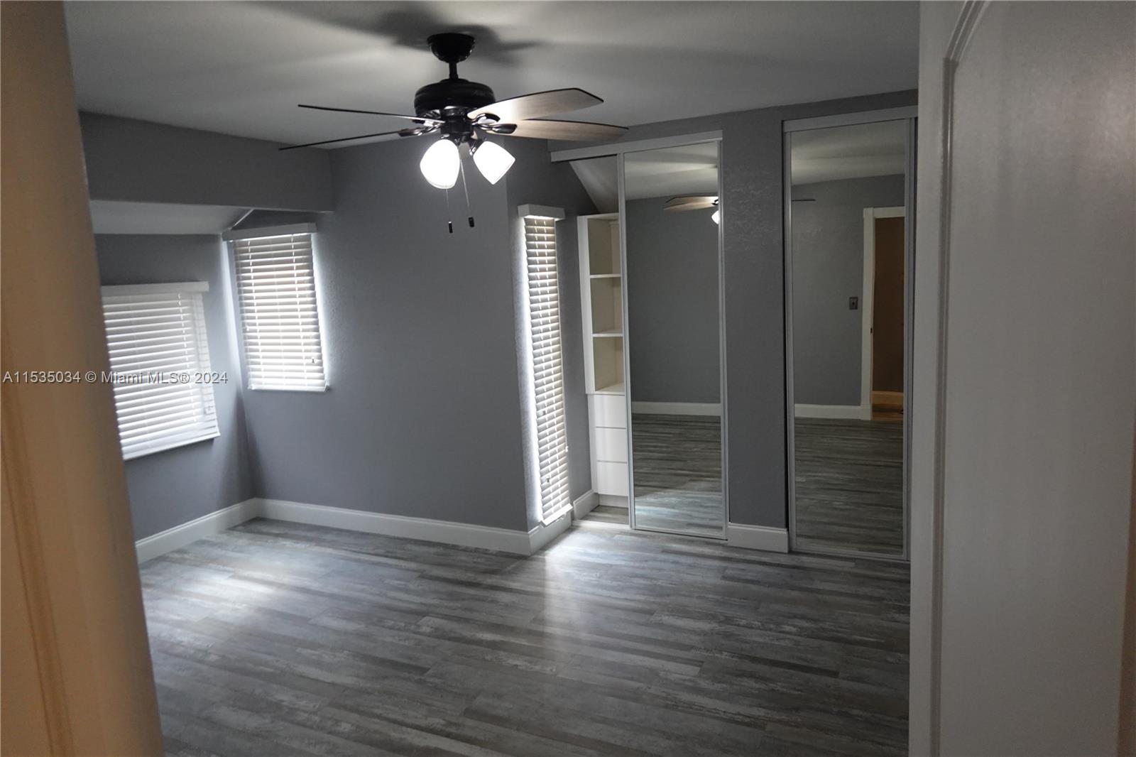 Townhouses at Jacaranda Condominiums Plantation, FL 33324 - Photo 38 of 50 a view of an empty room with wooden floor and a window