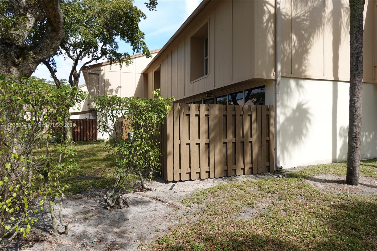 Townhouses at Jacaranda Condominiums Plantation, FL 33324 - Photo 4 of 50 a view of a backyard