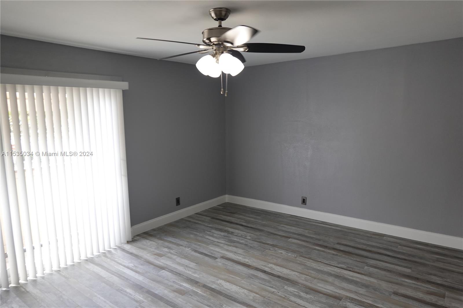 Townhouses at Jacaranda Condominiums Plantation, FL 33324 - Photo 45 of 50 wooden floor in an empty room with a window