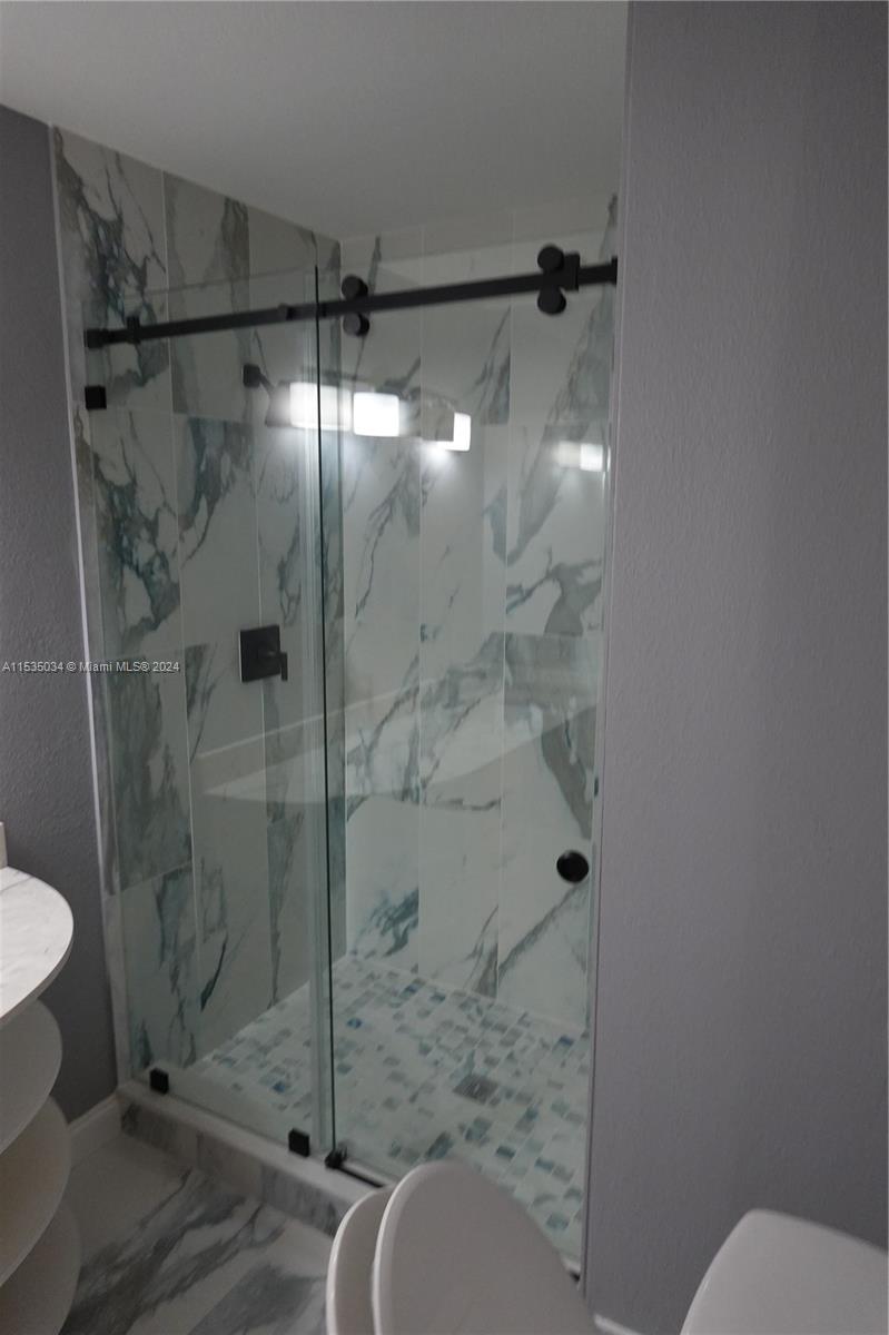 Townhouses at Jacaranda Condominiums Plantation, FL 33324 - Photo 48 of 50 a bathroom with a shower and toilet