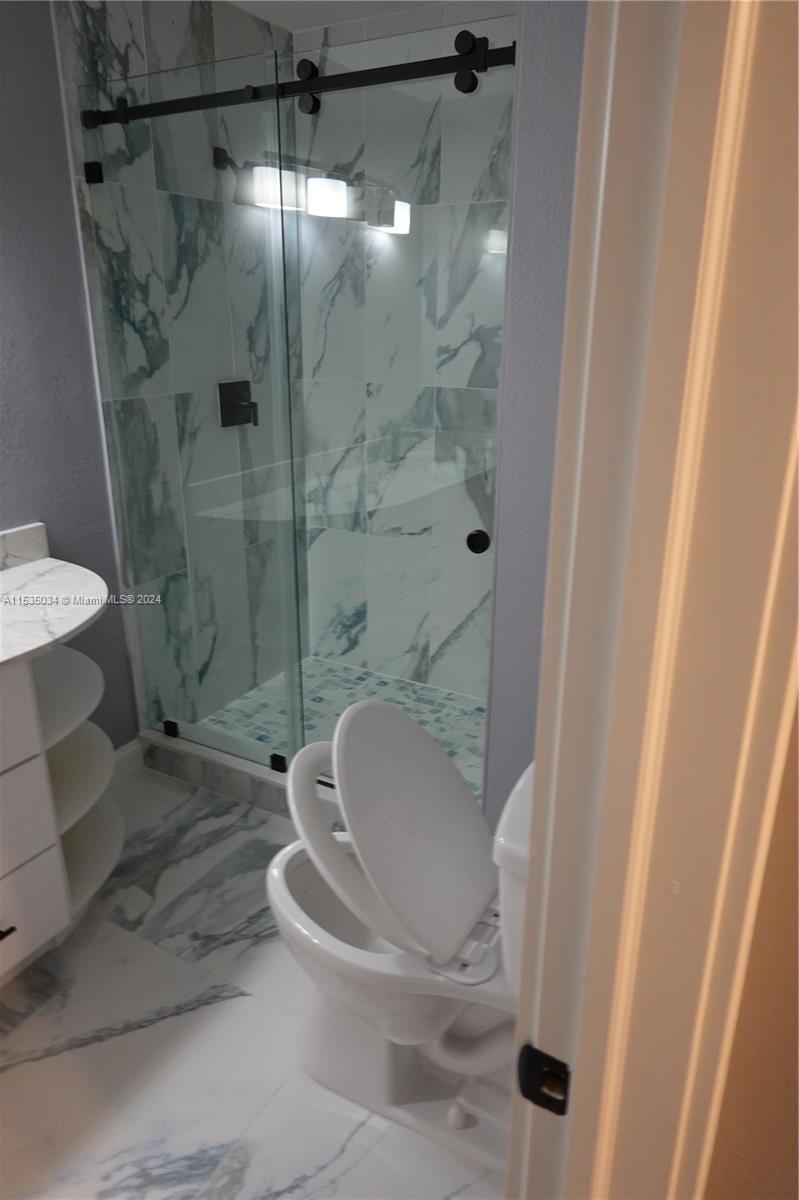 Townhouses at Jacaranda Condominiums Plantation, FL 33324 - Photo 50 of 50 a bathroom with a shower and a toilet