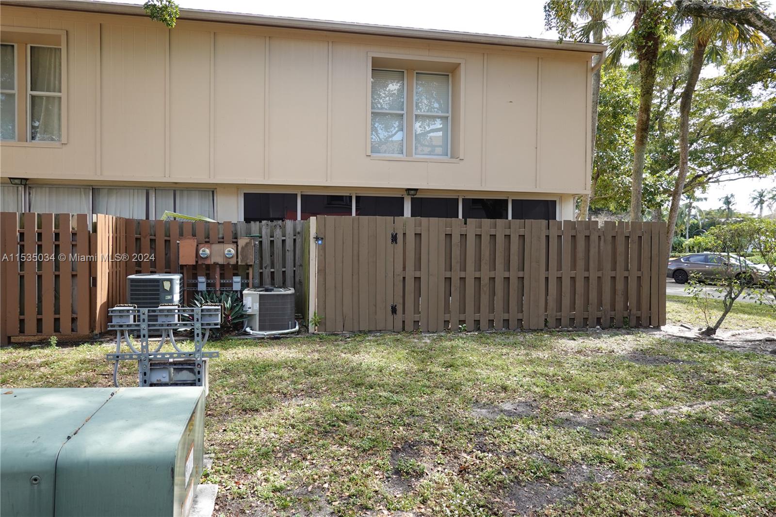 Townhouses at Jacaranda Condominiums Plantation, FL 33324 - Photo 5 of 50 a view of a house with backyard porch and sitting area