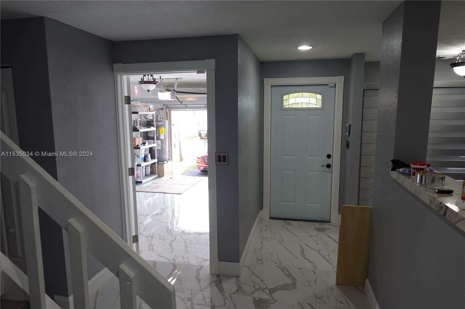 Townhouses at Jacaranda Condominiums Plantation, FL 33324 - Photo 9 of 50 a view of a hallway with wooden floor and a bathroom
