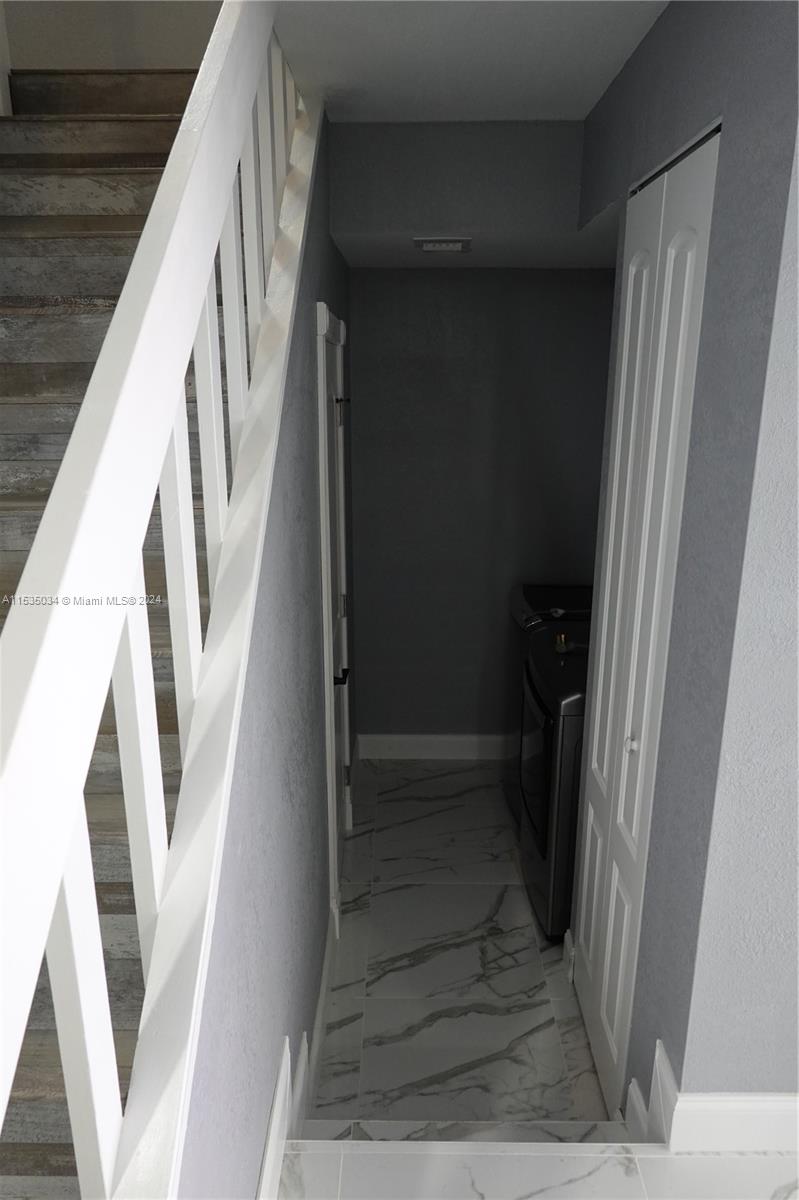 Townhouses at Jacaranda Condominiums Plantation, FL 33324 - Photo 10 of 50 a view of staircase with white walls and a window