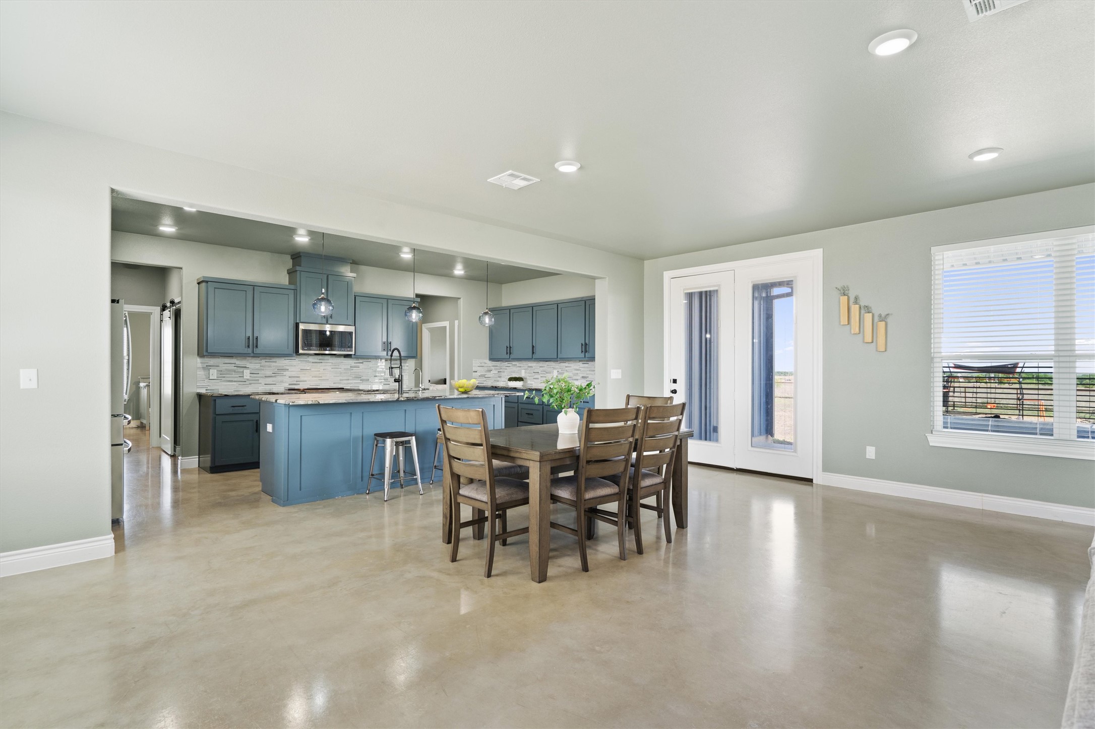15073 Armstrong Estates Road Salado, TX 76571 - Photo 11 of 40 a living room with furniture a dining table and kitchen view