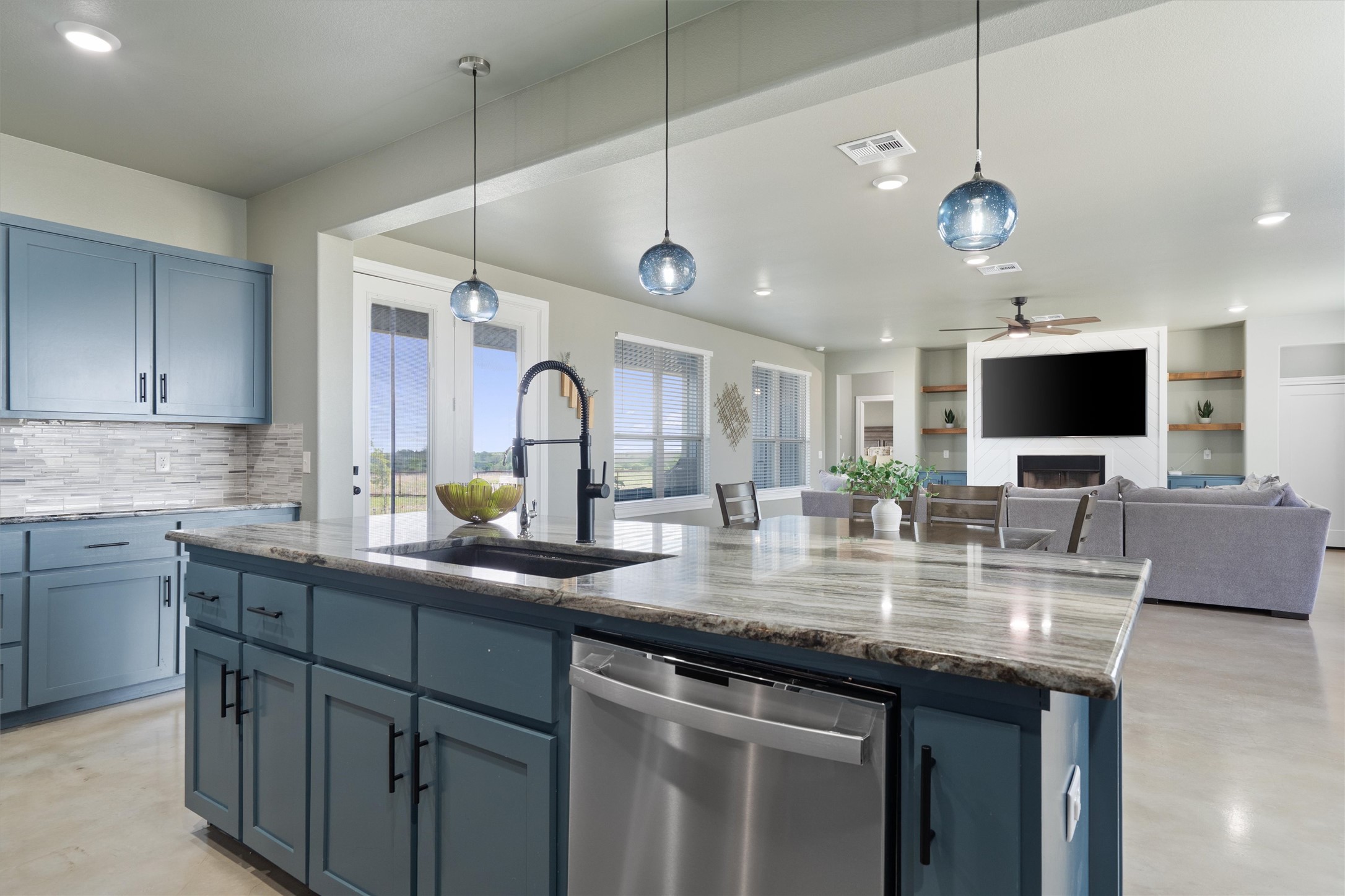 15073 Armstrong Estates Road Salado, TX 76571 - Photo 13 of 40 a kitchen with stainless steel appliances granite countertop a sink and a microwave