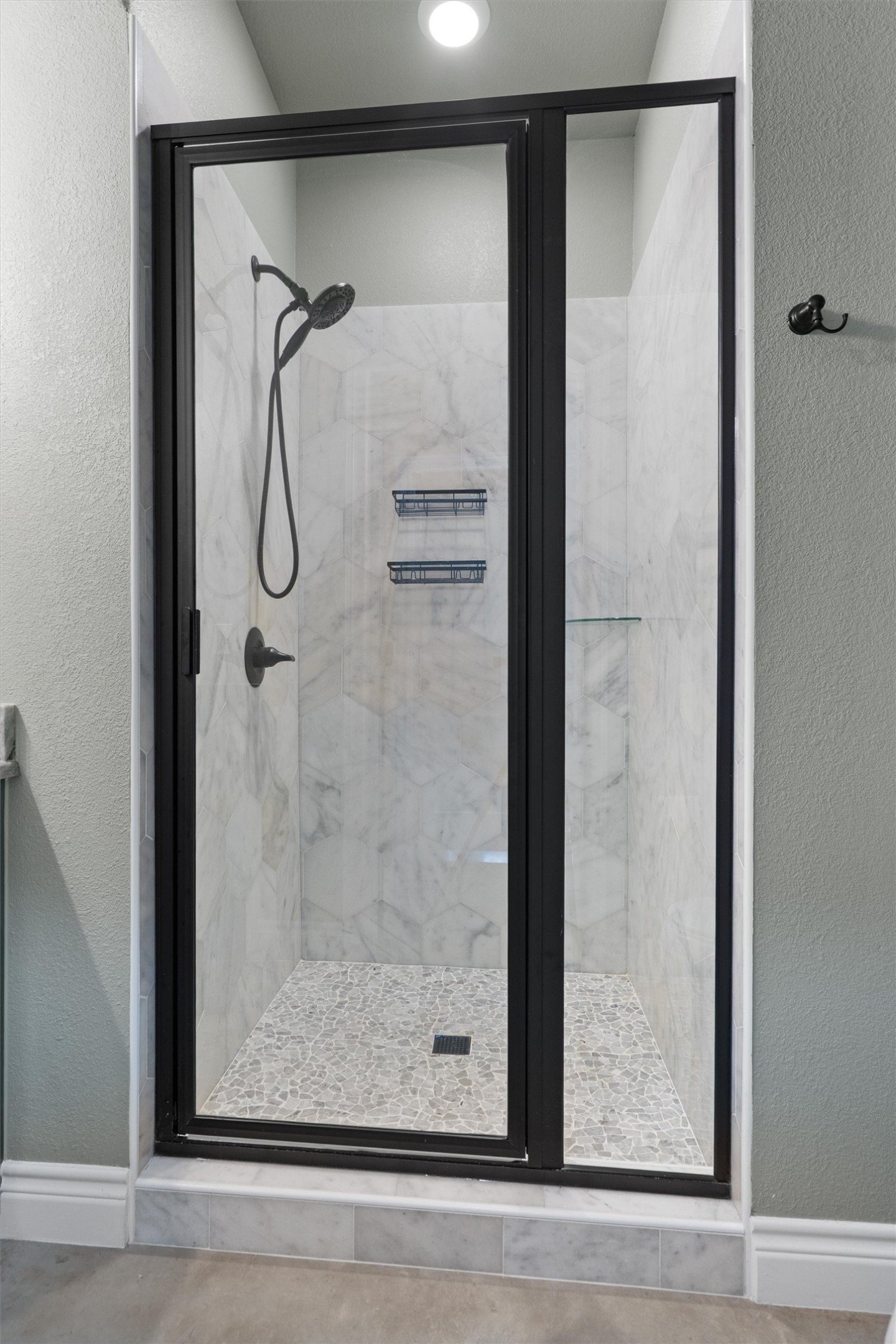 15073 Armstrong Estates Road Salado, TX 76571 - Photo 24 of 40 a bathroom with a glass shower door