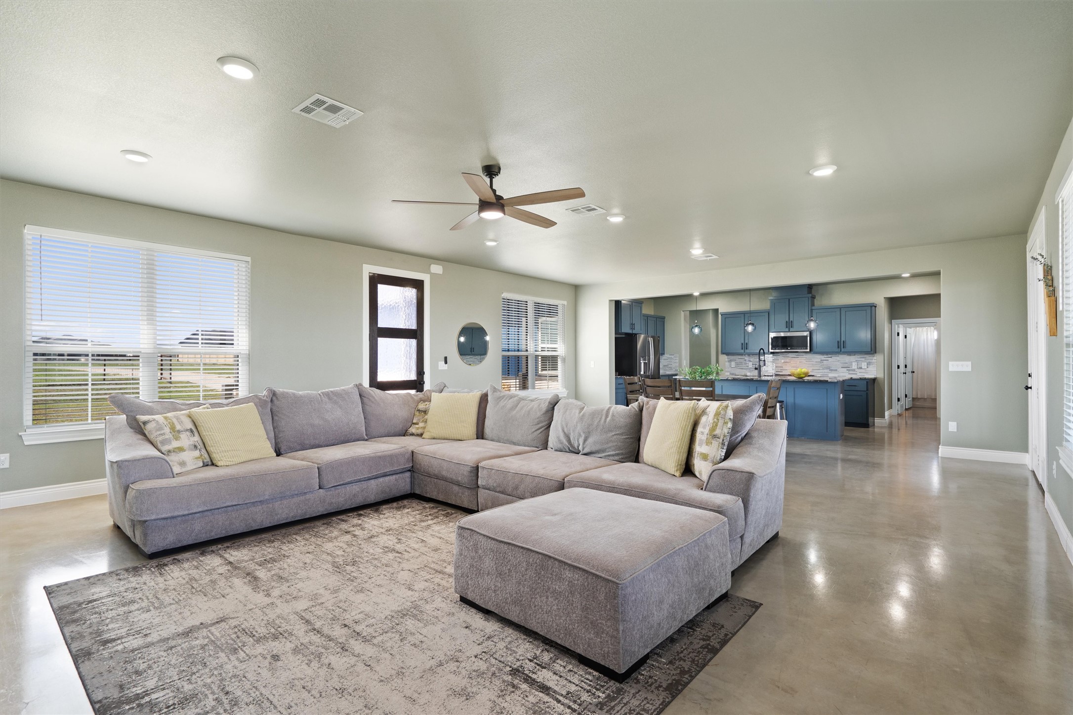 15073 Armstrong Estates Road Salado, TX 76571 - Photo 4 of 40 a living room with furniture and view of kitchen
