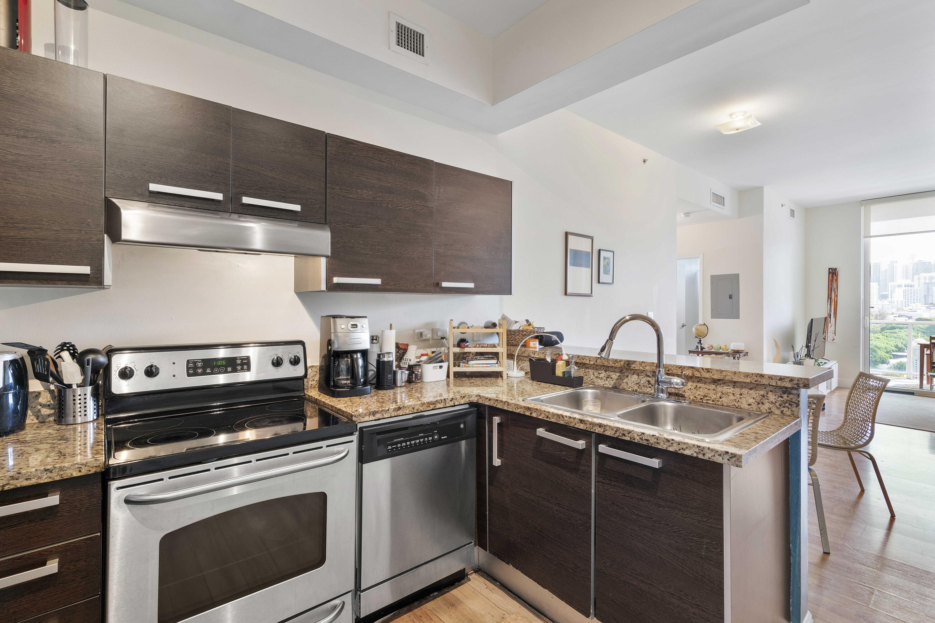 2525 Southwest 3rd Avenue, Unit 807 Miami, FL 33129 - Photo 19 of 27 a kitchen with a sink cabinets and appliances