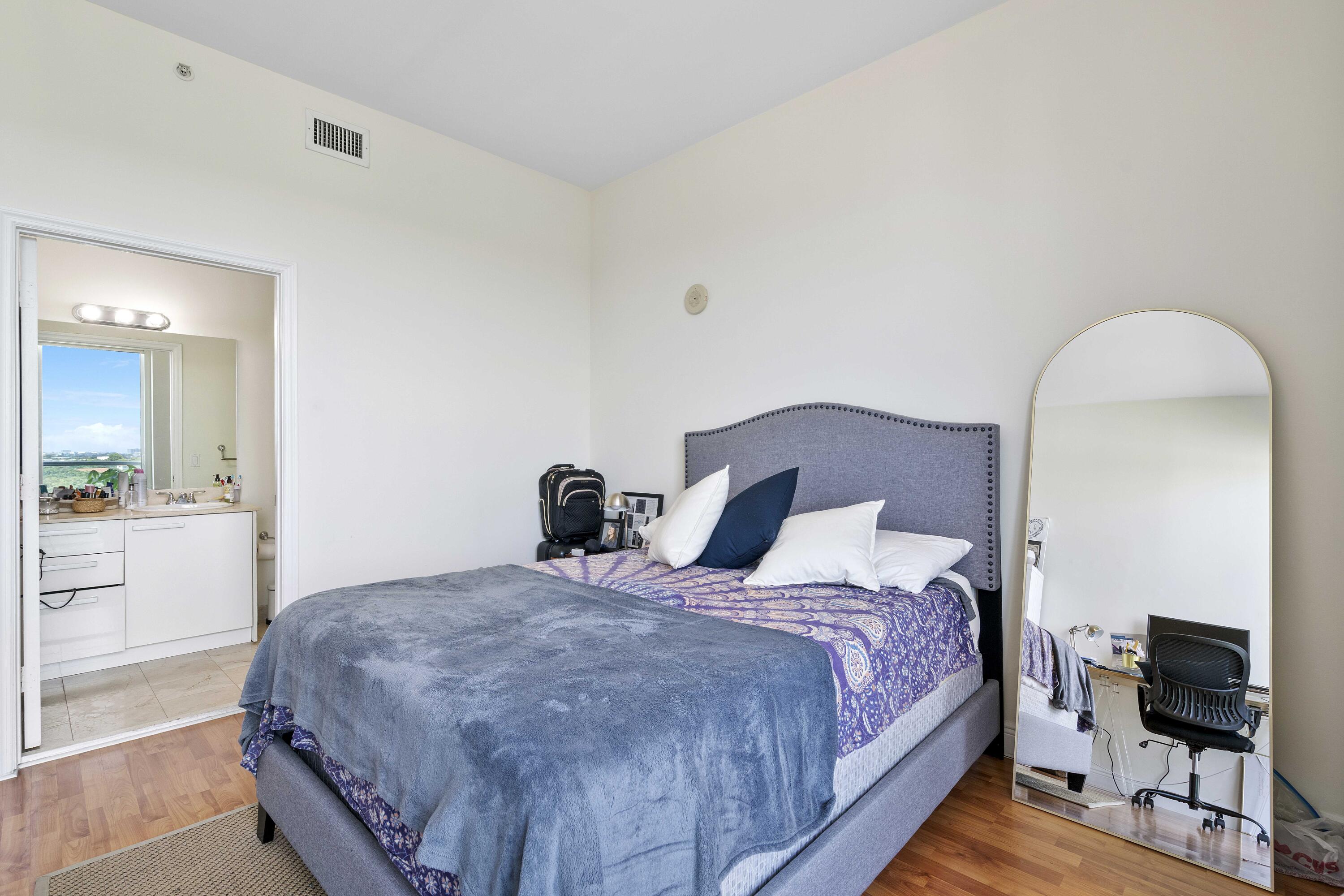 2525 Southwest 3rd Avenue, Unit 807 Miami, FL 33129 - Photo 22 of 27 a bedroom with a bed and a view of bathroom