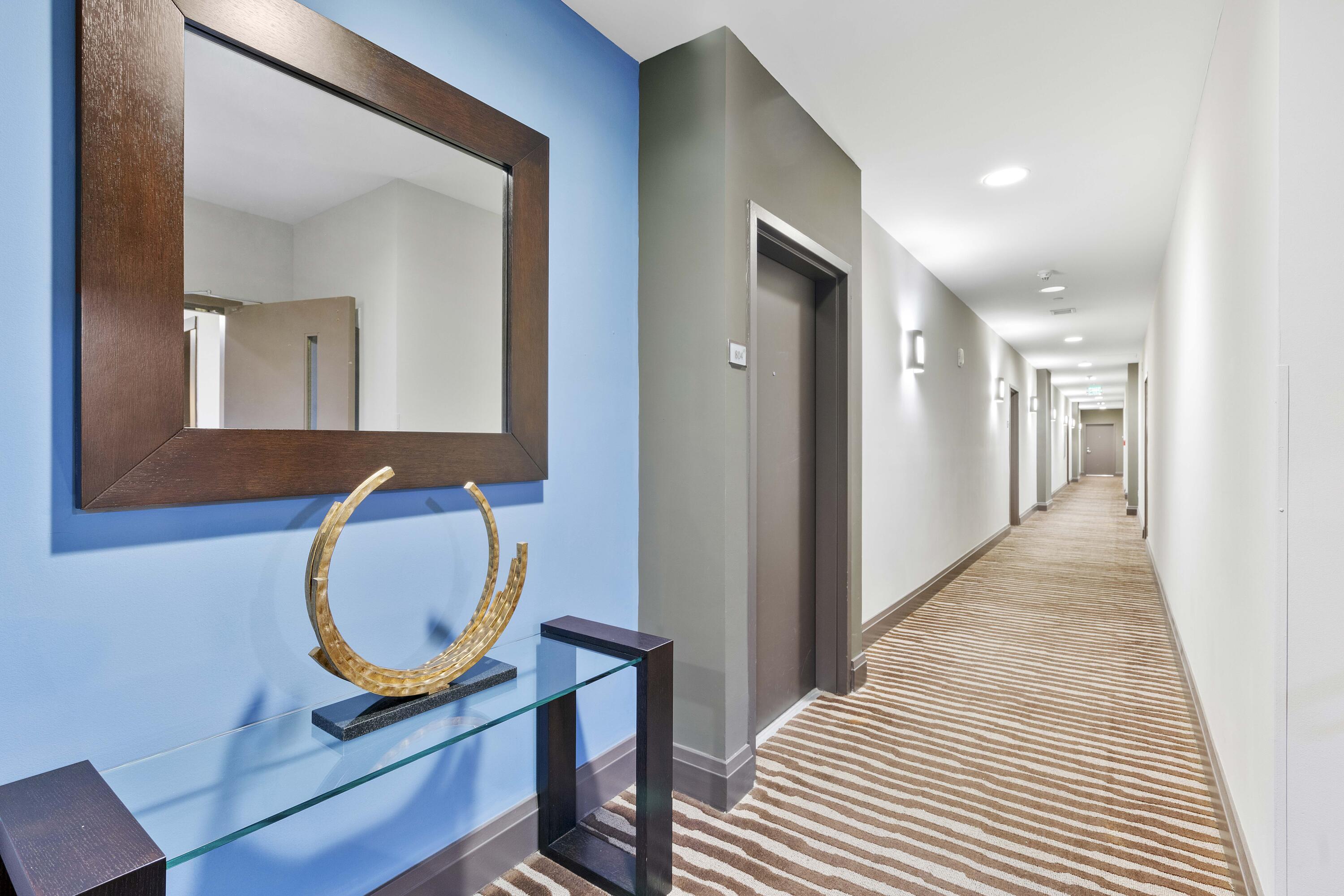 2525 Southwest 3rd Avenue, Unit 807 Miami, FL 33129 - Photo 27 of 27 a view of a hallway with wooden floor and staircase