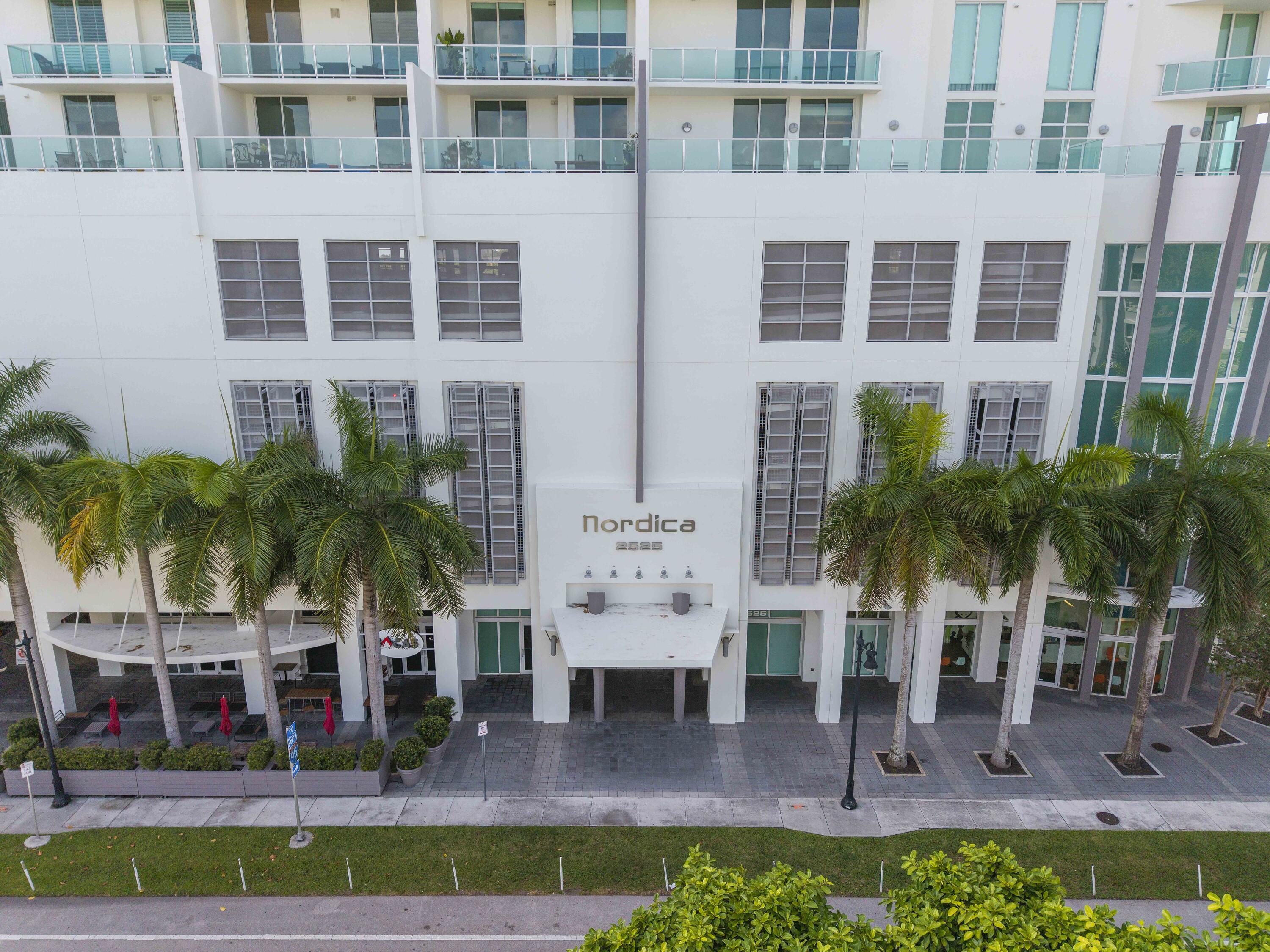 2525 Southwest 3rd Avenue, Unit 807 Miami, FL 33129 - Photo 7 of 27 a front view of multiple houses with swimming pool