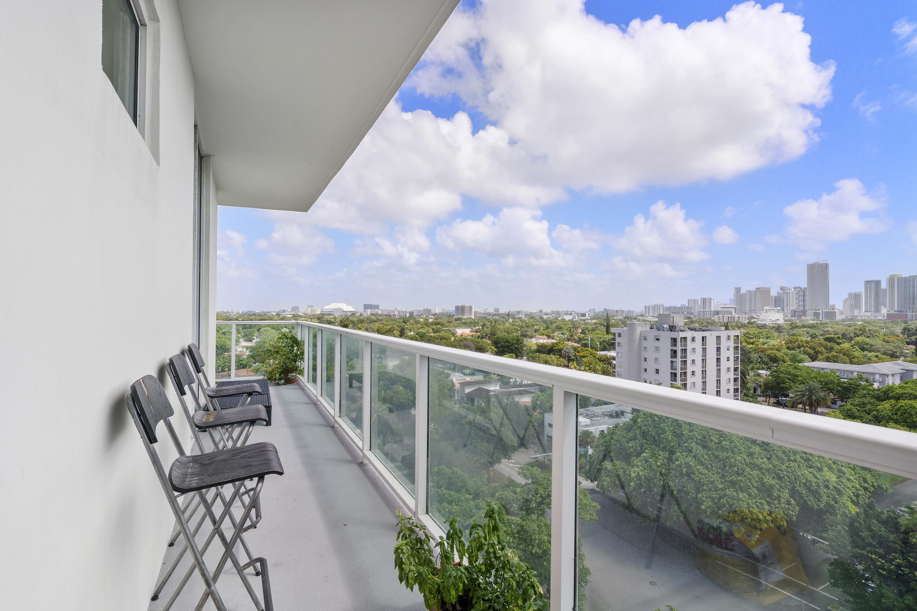 2525 Southwest 3rd Avenue, Unit 807 Miami, FL 33129 - Photo 8 of 27 a view of a balcony with outdoor seating