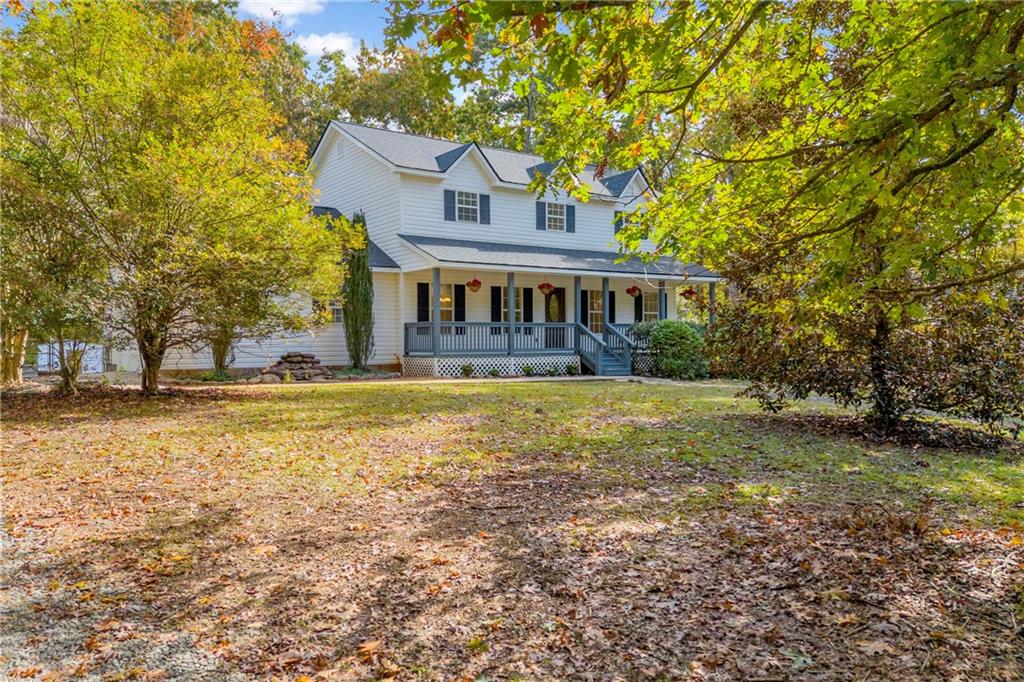 450 Stagecoach Way Danielsville, GA 30633 - Photo 15 of 65 a view of a house with a garden