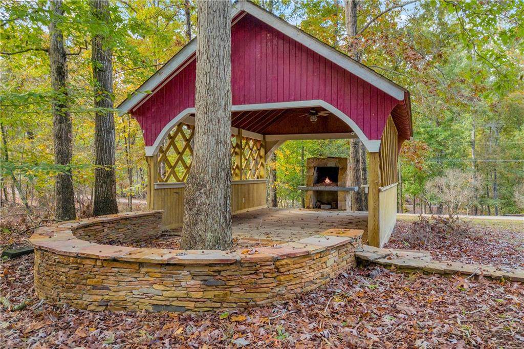 450 Stagecoach Way Danielsville, GA 30633 - Photo 17 of 65 a view of a house with backyard and sitting area