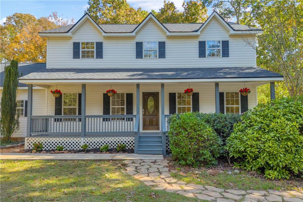 450 Stagecoach Way Danielsville, GA 30633 - Photo 2 of 65 a view of a house with a small yard and plants