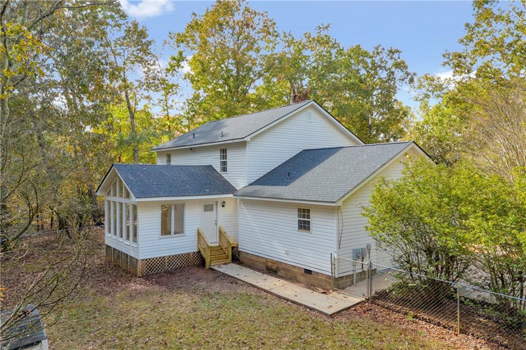 450 Stagecoach Way Danielsville, GA 30633 - Photo 21 of 65 a house that has a tree in front of it