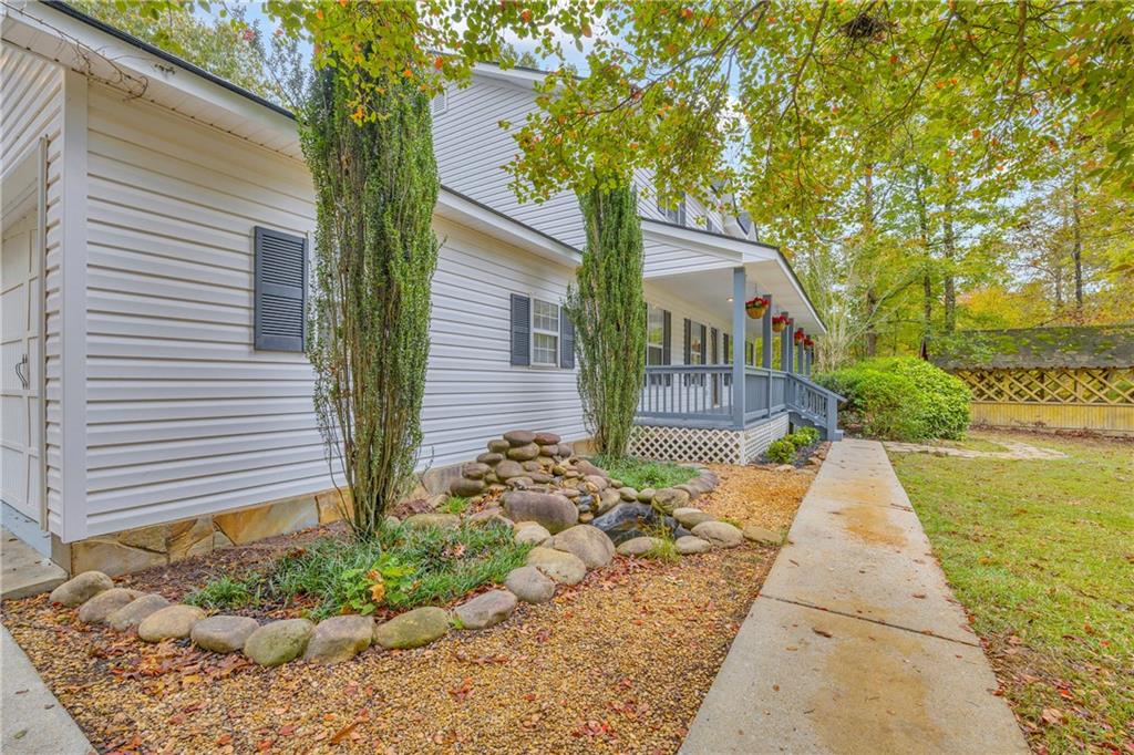 450 Stagecoach Way Danielsville, GA 30633 - Photo 22 of 65 a view of house with garden