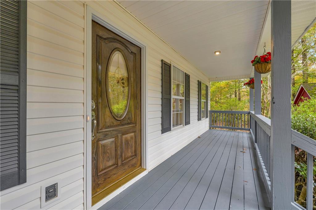 450 Stagecoach Way Danielsville, GA 30633 - Photo 23 of 65 a view of front door deck and a yard