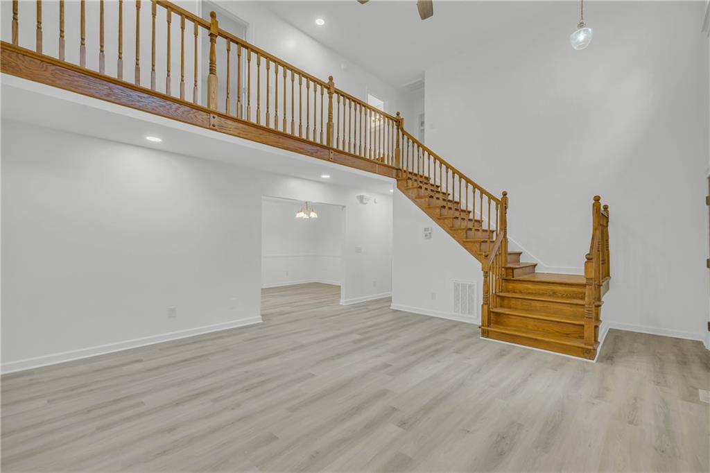 450 Stagecoach Way Danielsville, GA 30633 - Photo 25 of 65 a view of entryway and hall with wooden floor