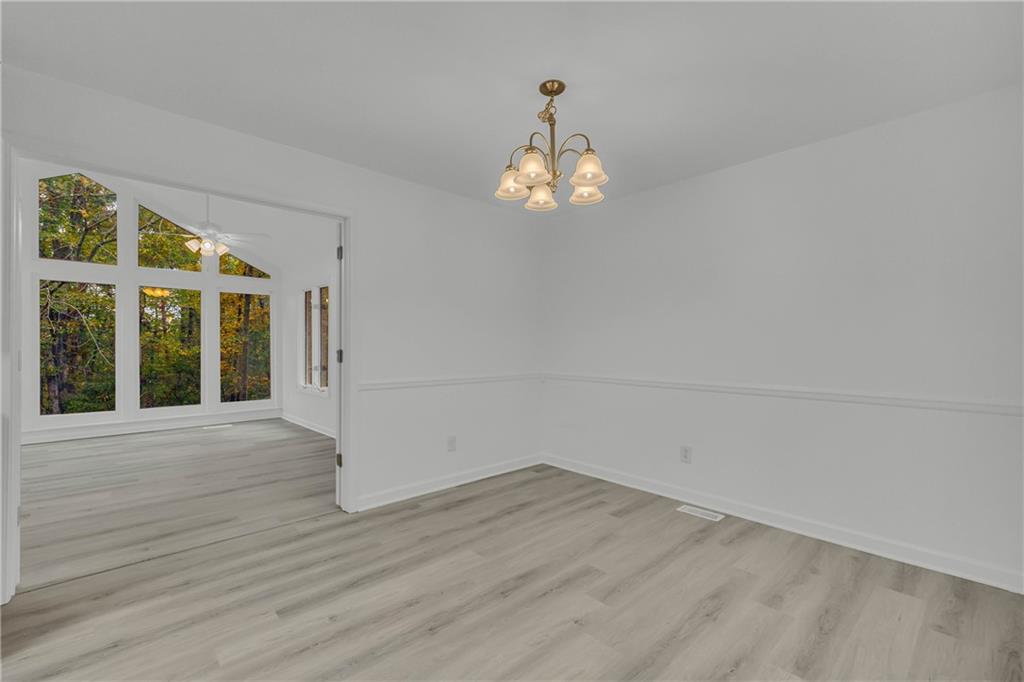450 Stagecoach Way Danielsville, GA 30633 - Photo 35 of 65 a view of empty room with wooden floor and fan