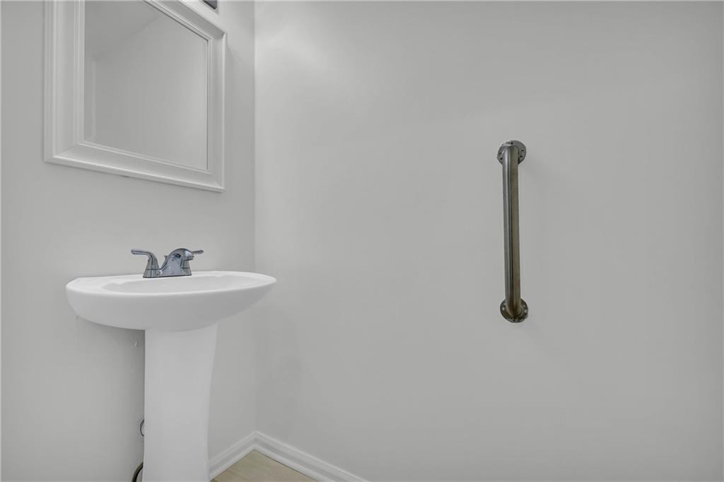 450 Stagecoach Way Danielsville, GA 30633 - Photo 37 of 65 a bathroom with a sink and mirror