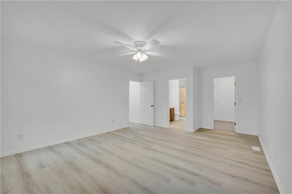 450 Stagecoach Way Danielsville, GA 30633 - Photo 44 of 65 a view of an empty room with a ceiling fan