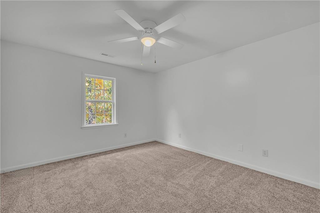 450 Stagecoach Way Danielsville, GA 30633 - Photo 48 of 65 an empty room with a window