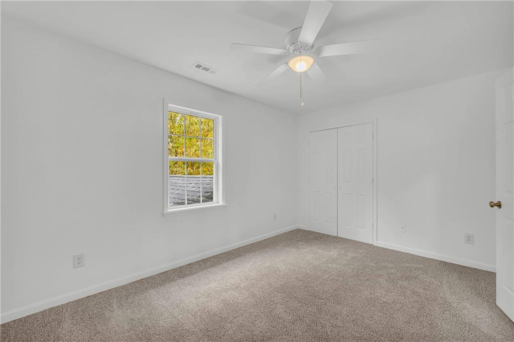 450 Stagecoach Way Danielsville, GA 30633 - Photo 51 of 65 an empty room with a window