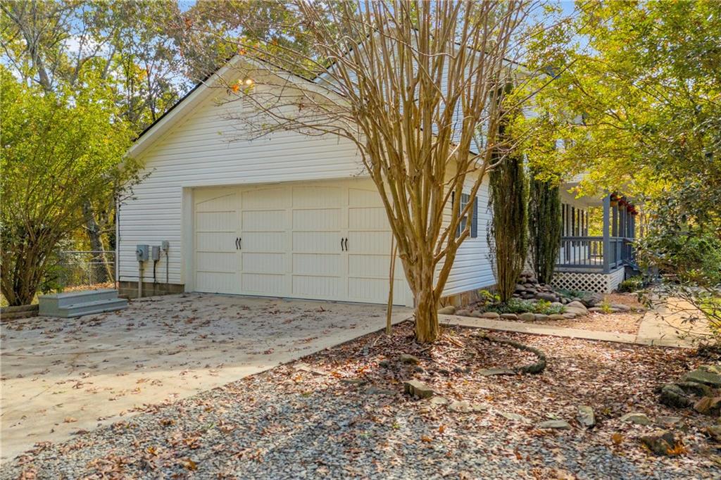 450 Stagecoach Way Danielsville, GA 30633 - Photo 57 of 65 a house with trees in front of it
