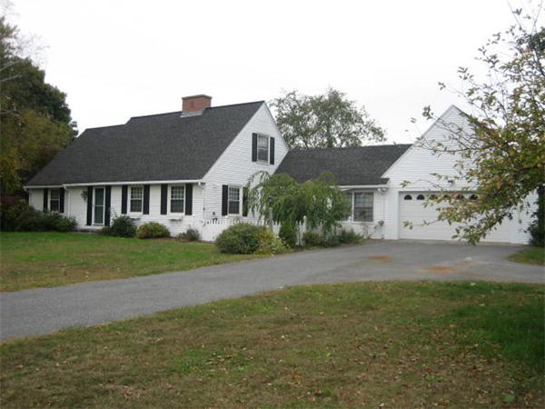 62 Florence Road Easthampton, MA 01027 - Photo 3 of 24 a front view of a house with a yard and trees