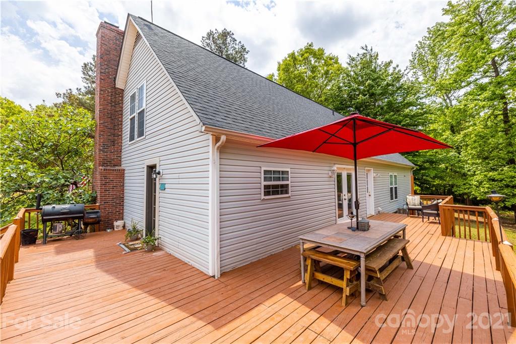 553 Sandifer Road York, SC 29745 - Photo 3 of 24 a view of a house with wooden deck and furniture