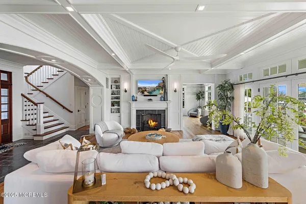 a large kitchen with kitchen island a large counter top space a sink and stainless steel appliances