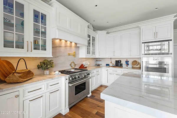 a living room with furniture and a mirror