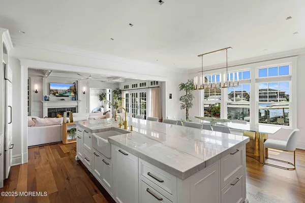 a bathroom with a toilet sink vanity and mirror