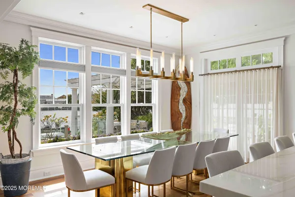 a view of staircase with railing and white walls