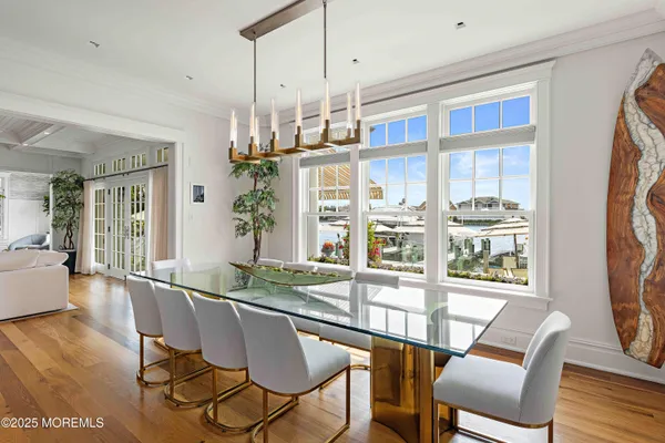 a spacious bedroom with a bed a couch and large window