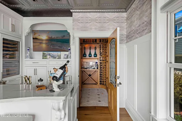 a bedroom with a large bed and a large window