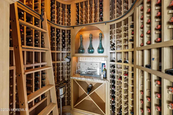 a spacious bedroom with a bed and a cabinets