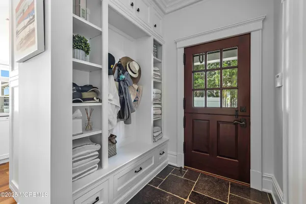 a view of bathroom with a toilet a sink and a mirror
