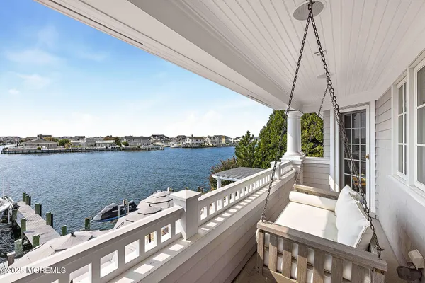 a view of a swimming pool with lounge chairs
