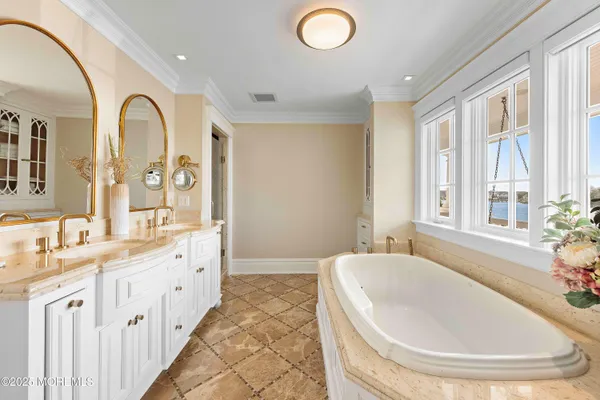 a balcony with furniture and a large window