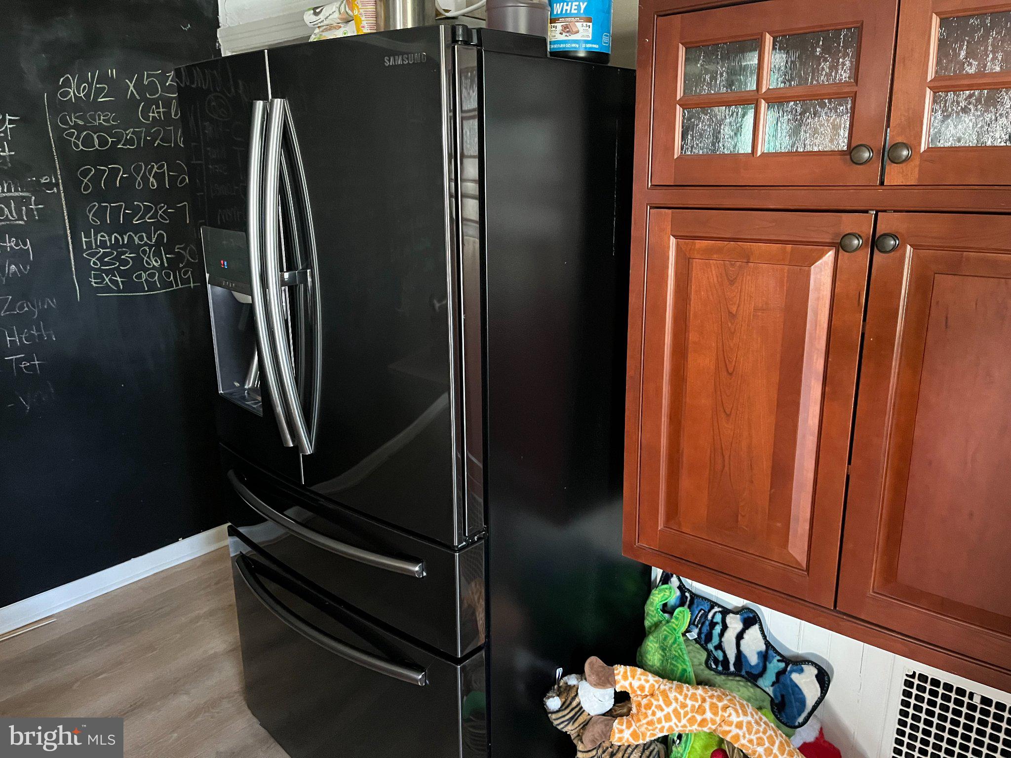 13825 Maugansville Road Maugansville, MD 21767 - Photo 14 of 37 Sleek black fridge in modern kitchen.