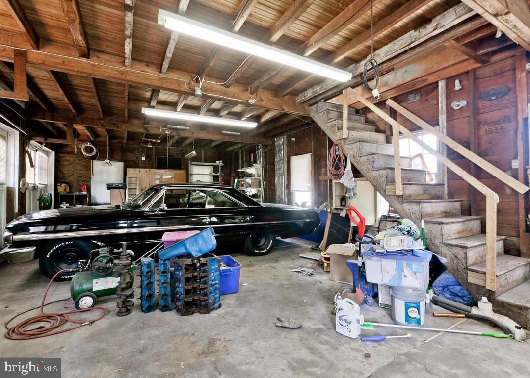 13825 Maugansville Road Maugansville, MD 21767 - Photo 28 of 37 Classic car in a rustic garage space.