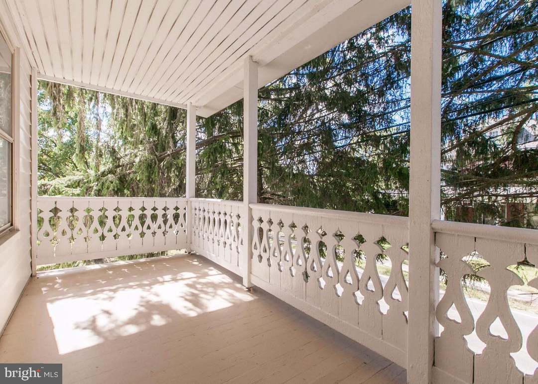 13825 Maugansville Road Maugansville, MD 21767 - Photo 5 of 37 Charming porch with serene views.
